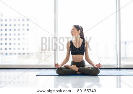 Meditation Lotus Pose. Young Attractive Woman Practicing Yoga, Sitting In Exercise, Working Out, Wea