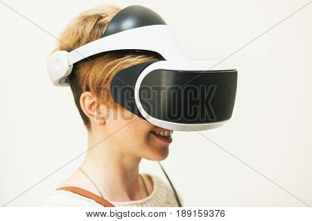 A woman with virtual reallity simulator on white background