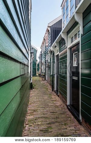 Marken Netherlands - August 08 2016. Picturesque traditional houses in Marken. It is known for its characteristic wooden houses and traditional costumes.