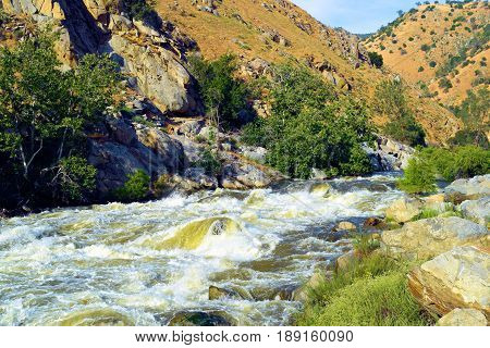 River with roaring rapids during spring taken at the Kern River in Kern County, CA