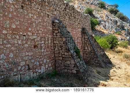 Fragment of the old fortress wall of the ancient Akrocorinth. Peloponnese Greece.