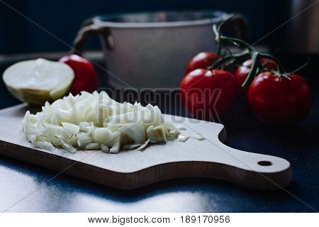 Chopped Onion On A Wooden Chopping Board