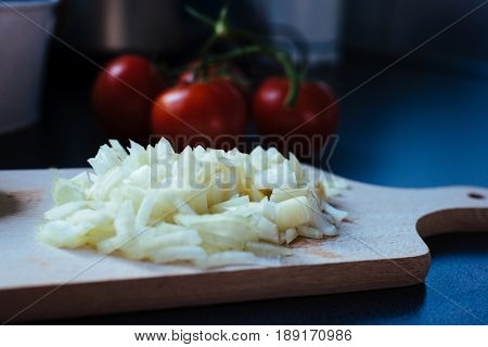 Chopped Onion On A Wooden Chopping Board