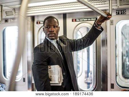 Businessman in full suit in New York subway metro