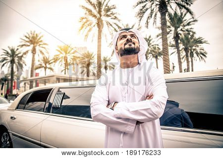 Arabic businessman in Dubai - Emirates man with limousine car