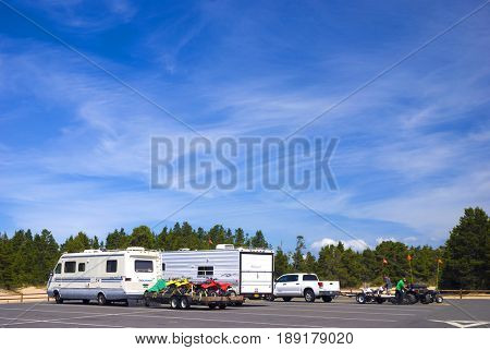 COOS BAY, OREGON, USA - September 3, 2009: Group of all-terrain vehicle entusiasts prepare their four wheel vehichles for riding at the Oregon Dunes National Recreation