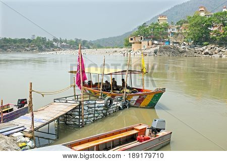 Ferry on the river Ganga at Laxman Jhula in India Asia