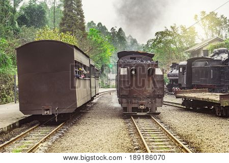 Changing of the direction of the steam narrow-gauge train with local people at the station on the way from Yuejin to Bagou. Jiayang Mining Region. Sichuan province. China