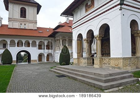 arched colonade and building of Sambata de Sus monastery in Transylvania Romania