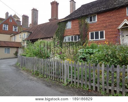 Old English buildings and a beautiful fenced yard in West Essex, England. United Kingdom.