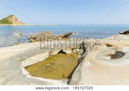 Beach Rocks With Craters In Karpasia, Island Of Cyprus