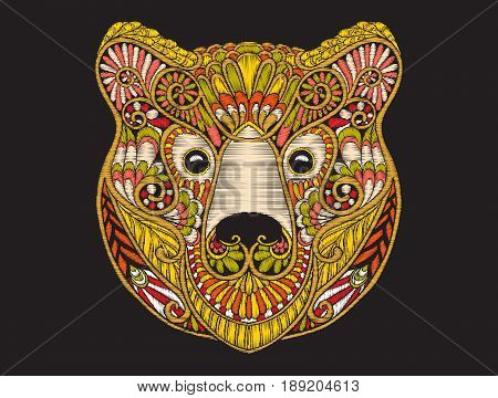 Embroidery ethnic patterned ornate head of brown bear. Stock vector illustration.