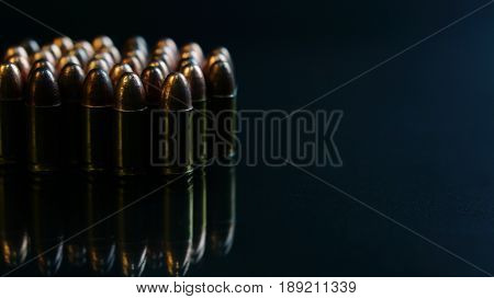 9mm bullets on the black mirror background