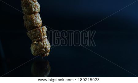 Crab or cicken roll cake on black mirror or glass. Thai tradition food
