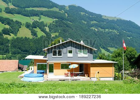 Lungern, Switzerland - 22 August 2015: Rural modern house at Lungern on the Swiss alps