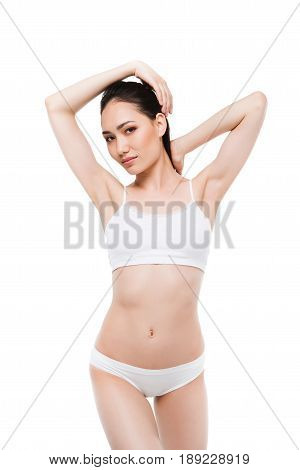 Sensual Asian Girl With Perfect Slim Body Isolated On White In Studio