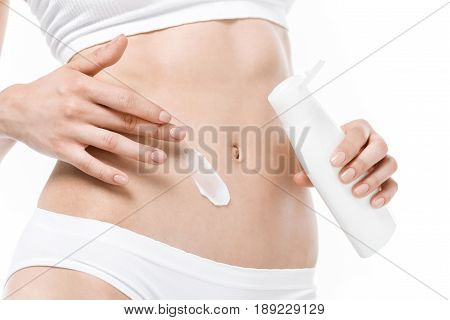 Cropped Shot Of Slim Woman In Underwear Applying Body Lotion