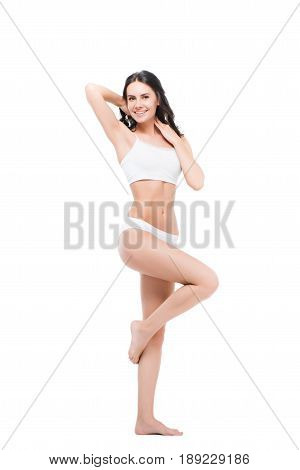 Beautiful Smiling Young Woman Posing In White Underwear And Looking At Camera