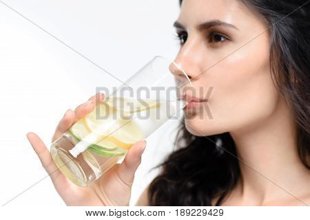 Portrait Of Woman Drinking Water With Lemon Isolated On White