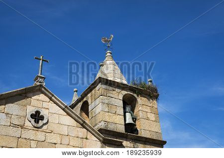 Detail of the bell tower of the Church of the historic village of Idanha a Velha in Portugal