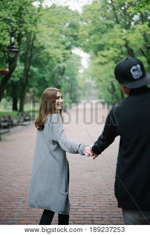 lovely cople  running and play in city park