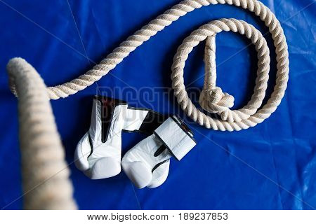 Sports Rope On The Background Of Boxing Gloves And A Punching Bag. Sports Equipment
