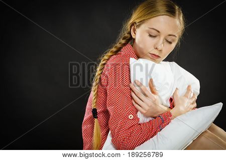 Sad Depressed Girl In Bed Gripping Pillow