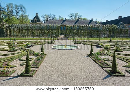 Apeldoorn, The Netherlands, May 8, 2016: Dutch baroque garden of The Loo Palace a former royal palace and now a national museum located in the outskirts of Apeldoorn in the Netherlands