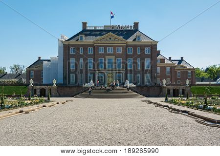 Apeldoorn, The Netherlands, May 8, 2016: Dutch baroque garden of The Loo Palace a former royal palace and now a national museum located in the outskirts of Apeldoorn in the Netherlands