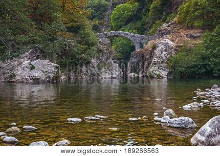 The Pont du Diable or Devil Bridge is a Roman bridge that spans the river Ardeche at about 10 m altitude. The bridge is located near the village of Thueyts in the Ardeche department in France
