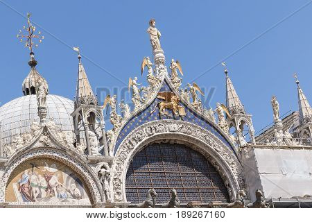 Photo shows an old italian city cathedral in the summer day.