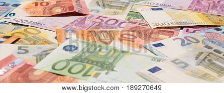 Pile of paper euro banknotes as part of the united country's payment system - Banner