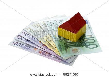 Toy blocks house on euro money household and financing concept.