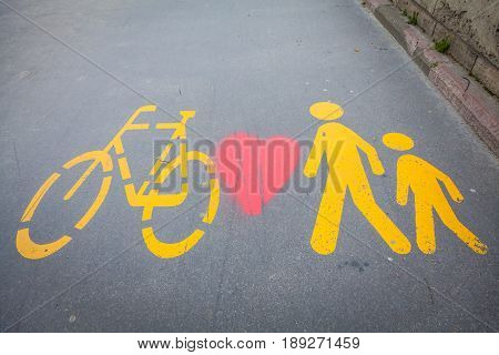 Bicycle Signs Painted On Asphalt