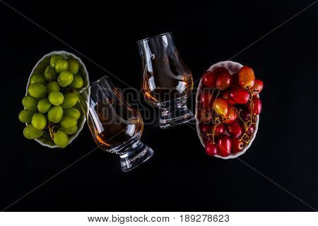 Single Malt Tasting Glasses, Single Malt Whisky In A Glass, White And Red Grapes In White Bowls