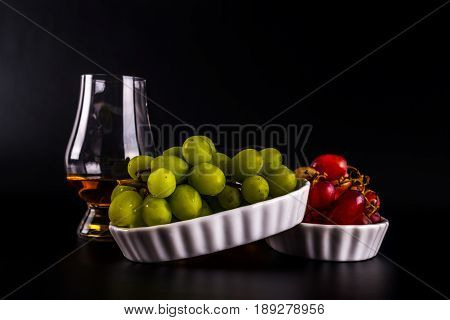 Single Malt Tasting Glasses, Single Malt Whisky In A Glass, White And Red Grapes In White Bowls