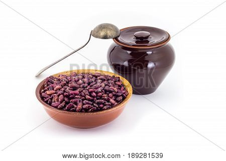 The Composition Of The Red Beans In A Clay Pial Next To A Clay Pot And A Copper Spoon,
