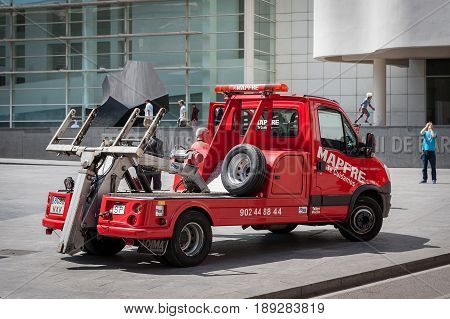 BARCELONA, SPAIN - MAY 2017: Red rescue wrecker car at street of Barcelona town, Spain.