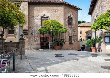BARCELONA, SPAIN - MAY 2017: Inner yard of traditional Spanish village (Poble Espanyol) with cafes and gift shops.