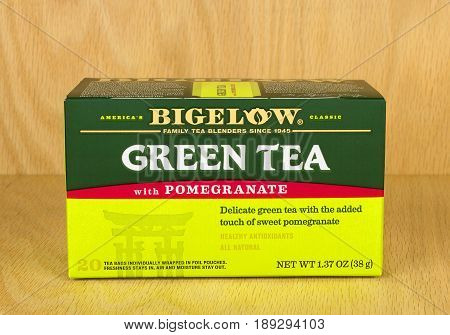 RIVER FALLS,WISCONSIN-JUNE 02,2017: A box of Bigelow brand green tea with pomegranate with a wood background.