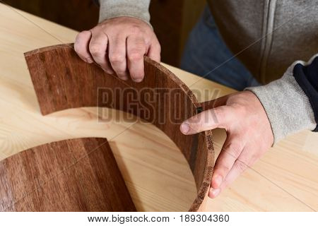Carppenter making merbau wood shell for handmade drum closeup