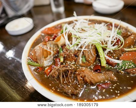 Close-up Jjimdak or Korean Steamed Chicken Vegetables and Noodle
