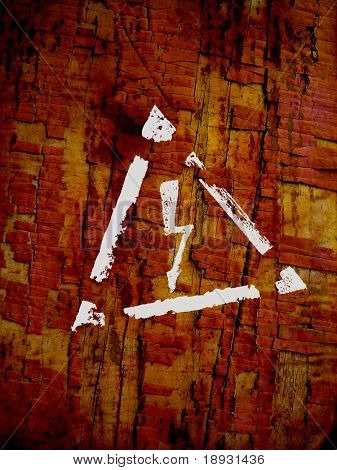 signo de alto voltaje sobre fondo grunge