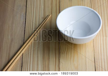 empty Bowl and chipsticks on the wooden table
