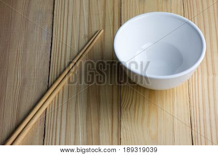empty Bowl and chipsticks on the wooden table