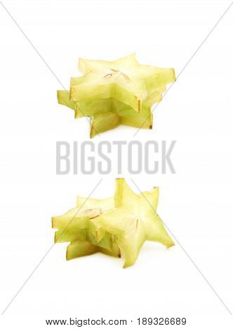 Pile of sliced carambola starfruit fruits isolated over the white background