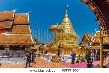 CHIANGMAI - MARCH 6: Locals and tourists come to pray at the Doi Suthep Temple in Chiang Mai, Thailand on March 6, 2017. The temple founded in 1385 is a major landmark tourist attraction in Chiang Mai