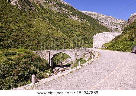 Airolo Switzerland - 7 august 2016: cyclists pedaling on the old road which leads to St. Gotthard pass on the Swiss alps