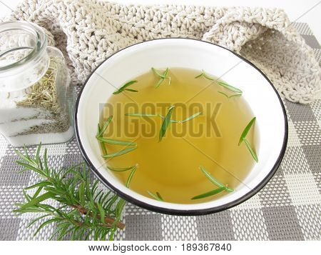 Footbath with rosemary bath salt in bowl