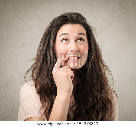 Undecided girl thinking